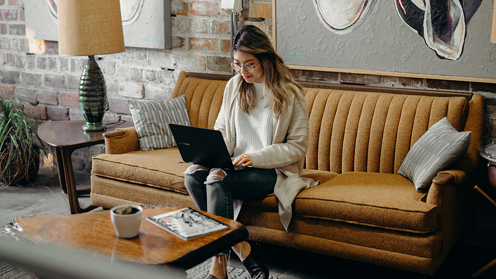 female using laptop to #breakthebias