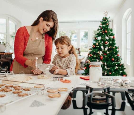 Mother and daughter baking together.